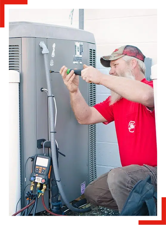 Comfort Control employee working on an outside HVAC unit